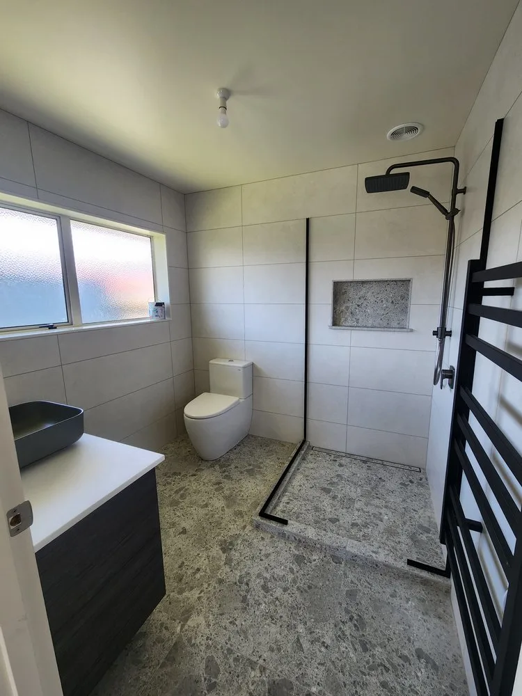 Modern ensuite upgrade with sleek basin and feature wall by Bathroom Renovations Kapiti