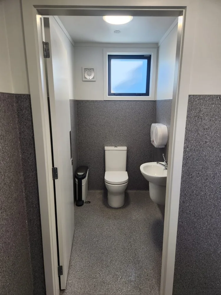 Small bathroom renovation in progress with future space for built-in storage by Bathroom Renovations Kapiti