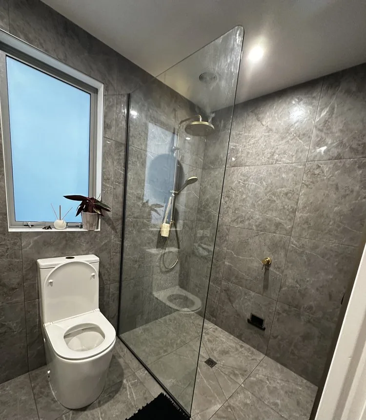 Contemporary bathroom featuring stylish fixtures and smart design by Bathroom Renovations Kapiti